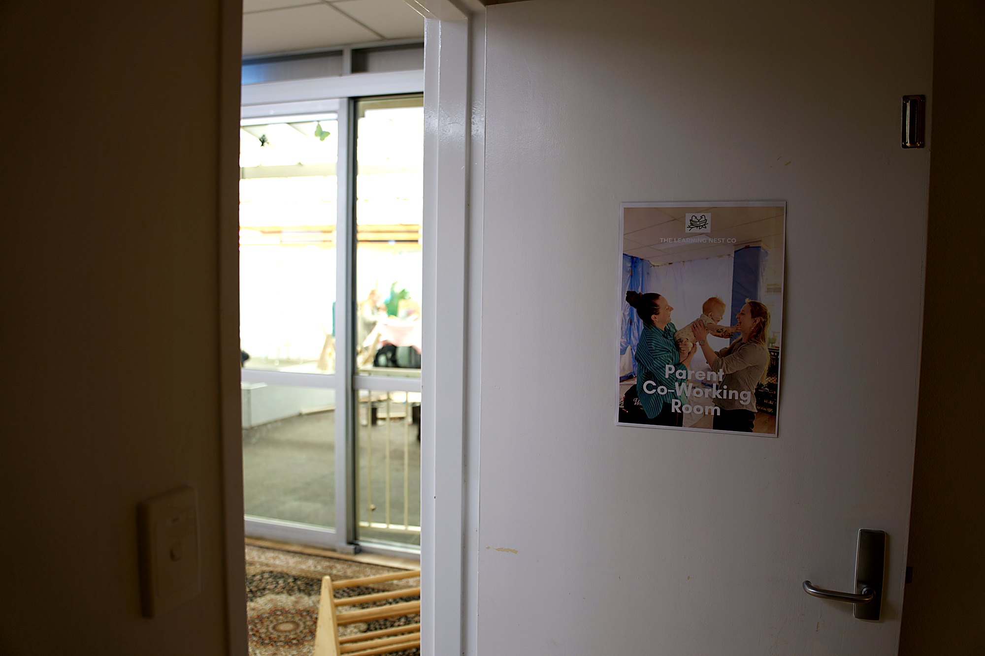 The Parent Co-Working Room door at The Learning Nest Co., looking into the space